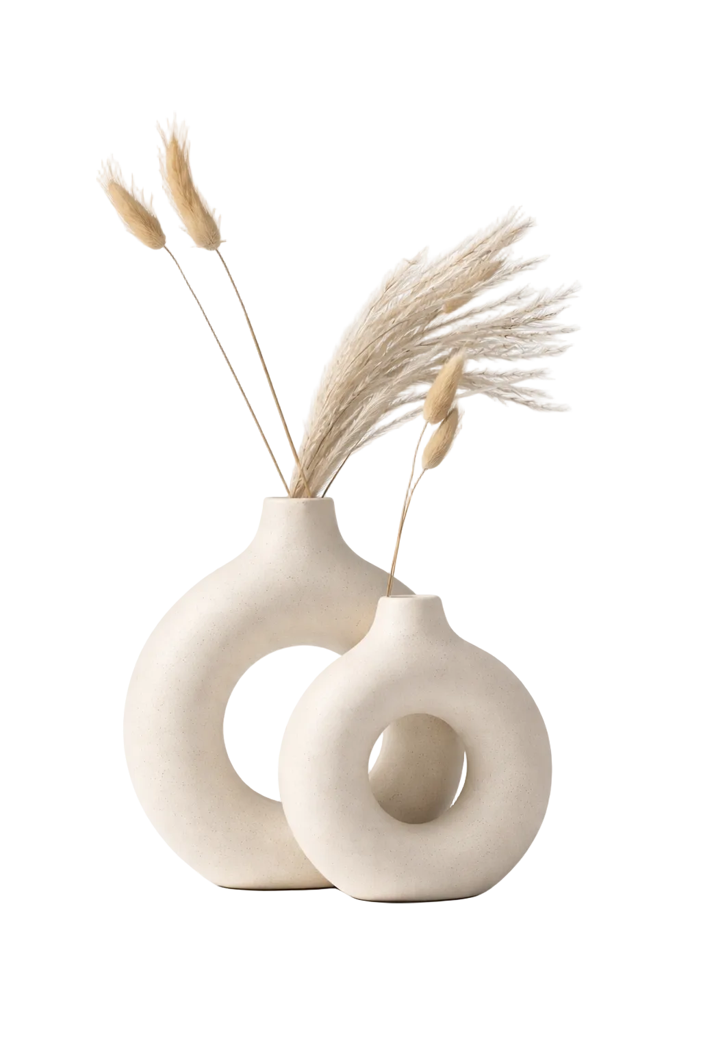 Two white ceramic vases with circular designs on a white background